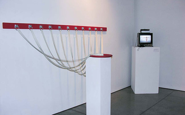 Chun Hua Catherine Dong's exhibition in Vancouver that includes a monitor that displays her very first performance and an object she used in her performance