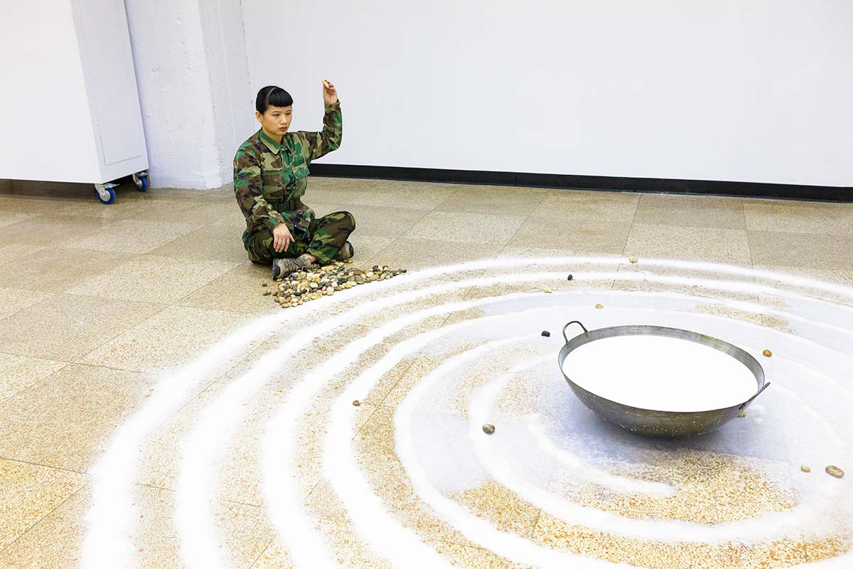 Chun Hua Catherine Dong throws rocks into milk as a way of meditation