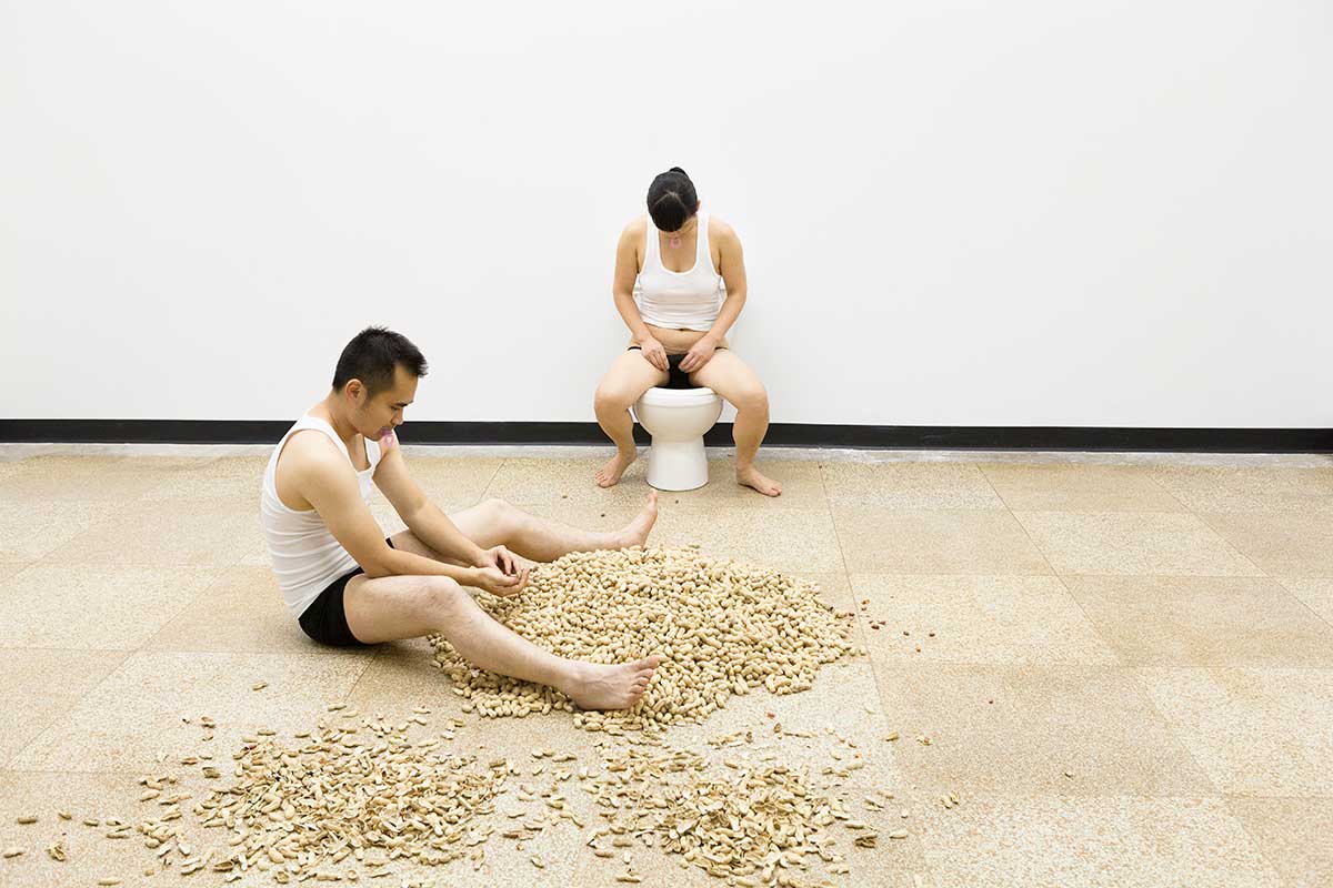 Chun Hua Catherine Dong is dumping peanut seeds into a toilet