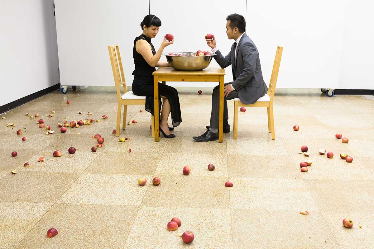 Chun Hua Catherine Dong looked at an apple with smiles, she examined it carefully, and them smashed the apple on a wall
