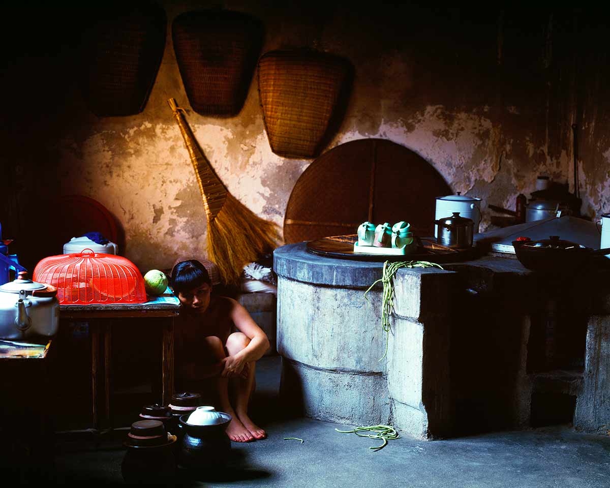 Chun Hua Catherine Dong re-visited a village in China where she was born. She walked in the village to seek out shadows and coroners in which to conceal herself 