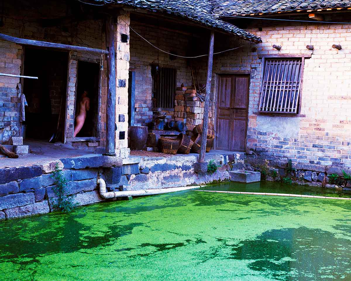 Chun Hua Catherine Dong re-visited a village in China where she was born. She walked in the village to seek out shadows and coroners in which to conceal herself 