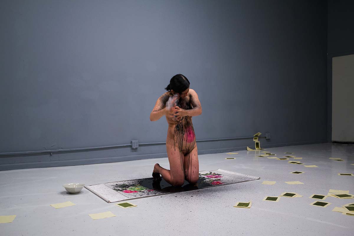 Chun Hua Catherine Dong's performance in Chicago: she shoots herself with ink