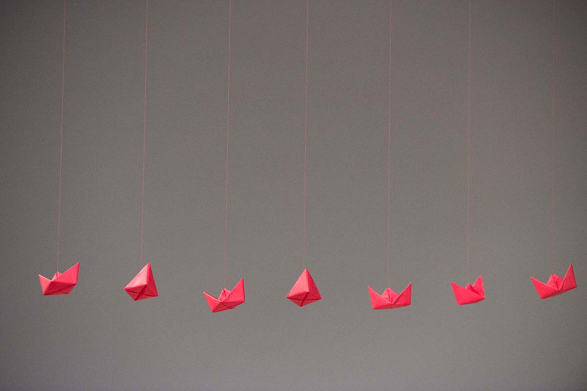 Chun Hua Catherine Dong's performance at 7a11d International Festival of Performance Art in 2016: red paper boats are hung on the celling