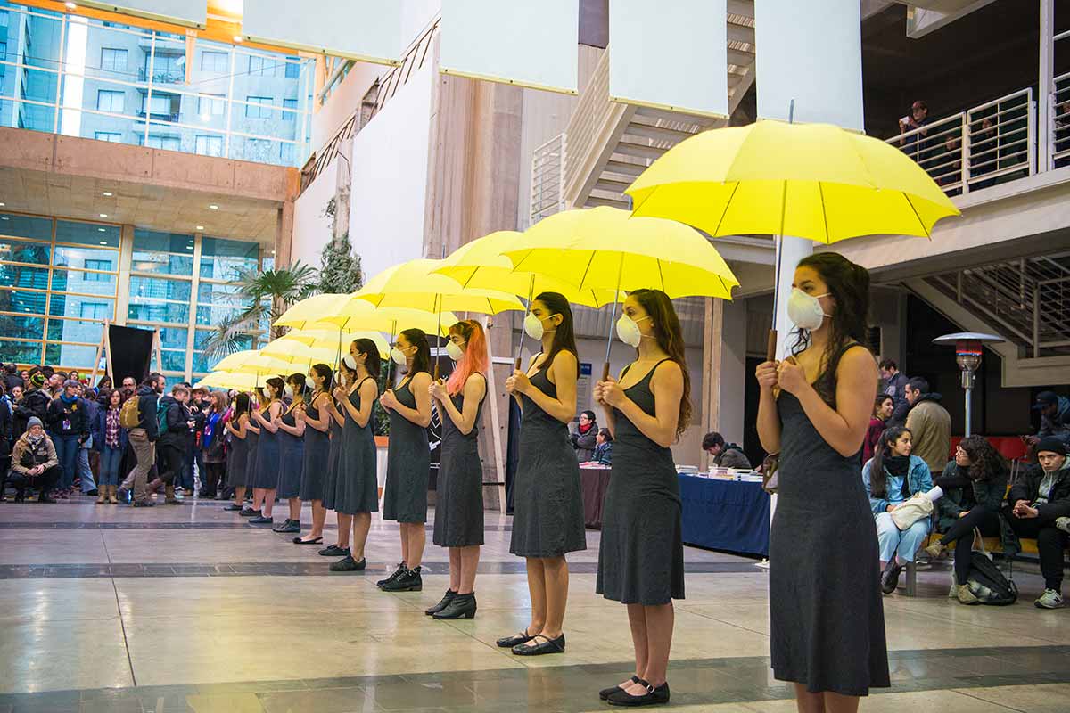 Chun Hua Catherine Dong's Yellow Umbrella performance at Universidad de Chile in Santiago as part of eX-centrico: dissidence, sovereignties, performance, organized by The Hemispheric Institute in 2016