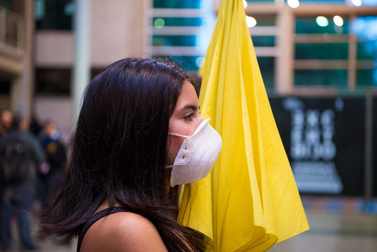 Chun Hua Catherine Dong's Yellow Umbrella performance at Universidad de Chile in Santiago as part of eX-centrico: dissidence, sovereignties, performance, organized by The Hemispheric Institute in 2016