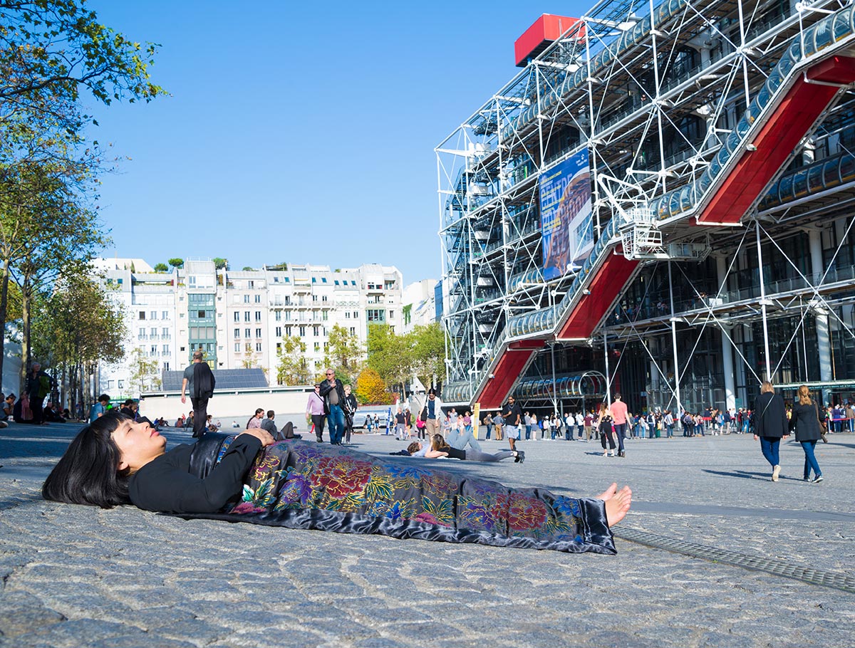 Chun Hua Catherine Dong celebrates her death and buries herself in front of Centre Pompidou in Paris