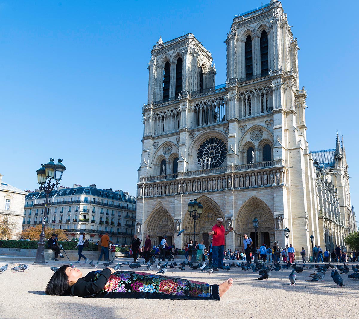 Chun Hua Catherine Dong celebrates her death and buries herself in front of Notre Dame Paris