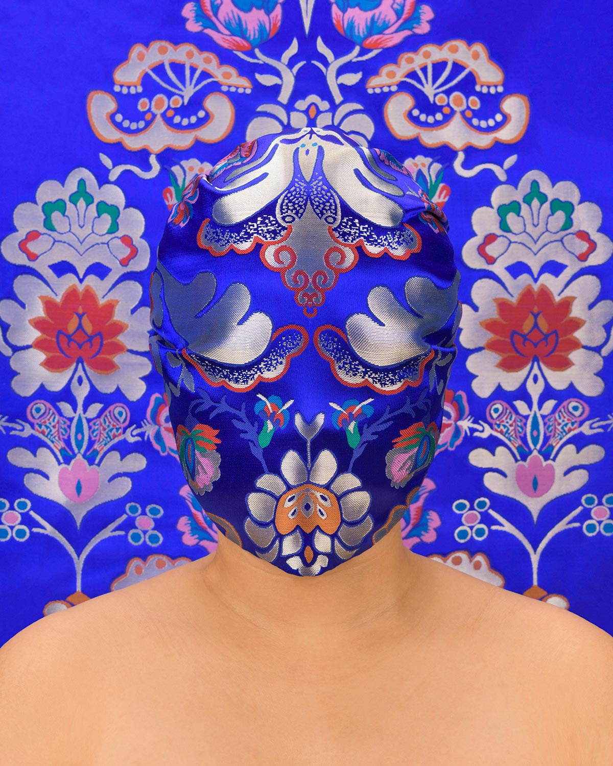Chun Hua Catherine Dong masks her face with beautiful fabric to make shame visible