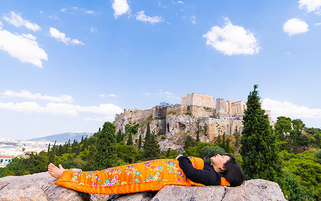 Chun Hua Catherine Dong celebrates her death and sleeps in front of Acropolis of Athens