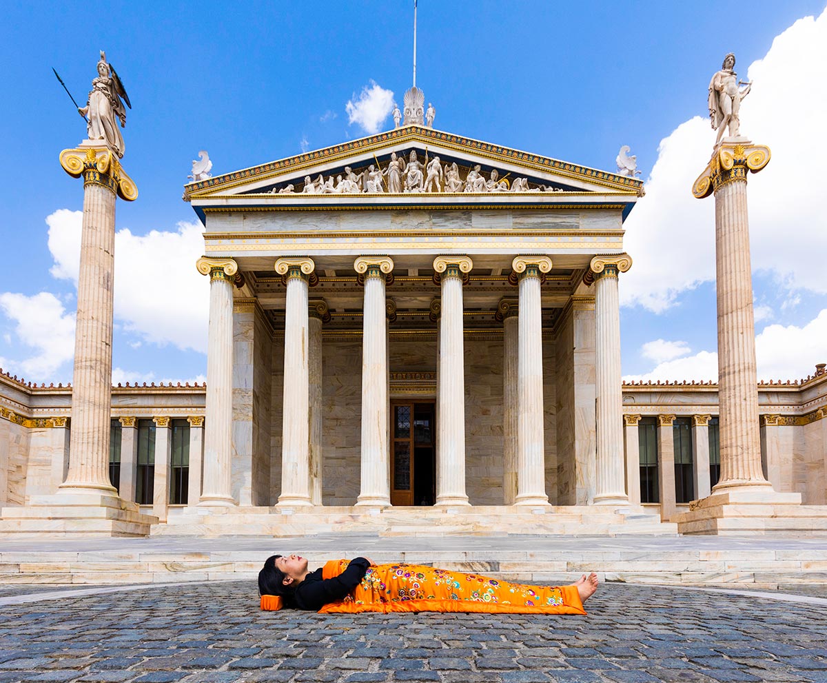 Chun Hua Catherine Dong celebrates her death and sleeps in front of Parthenon