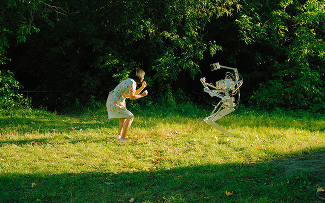 Chun Hua Catherine Dong fights with a robot in woods