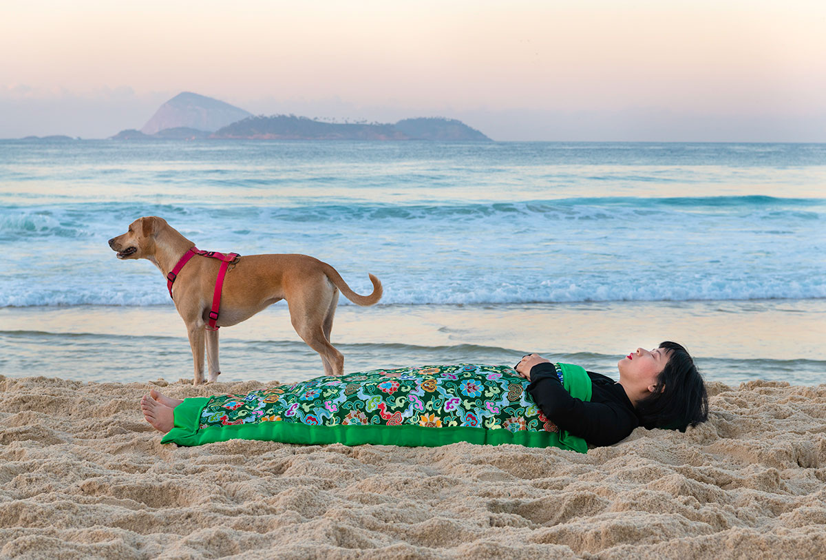 Chun Hua Catherine Dong is at -	Ipanema Beach with a dog in Rio de Janeiro