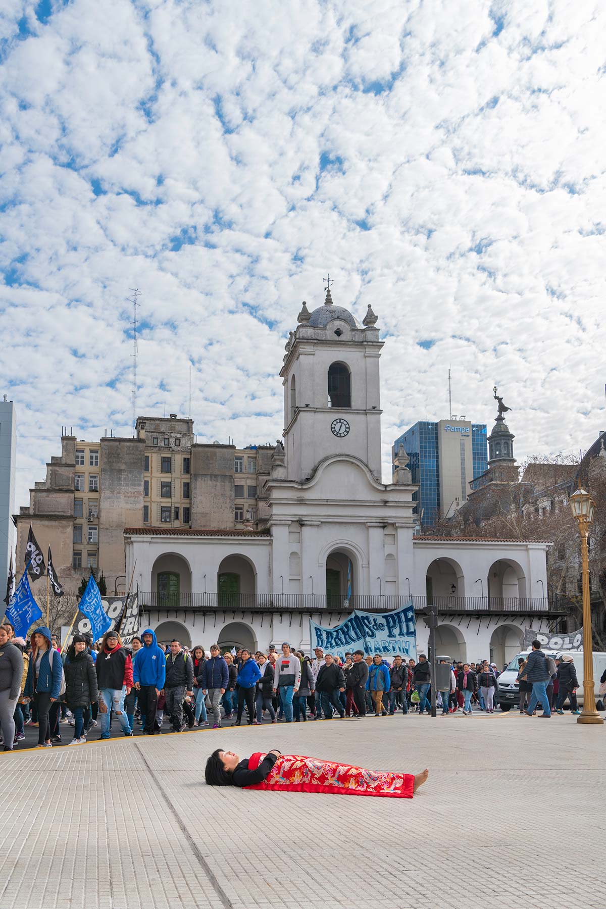 Chun Hua Catherine Dong  sleeps on a demonstration in Buenos Aires