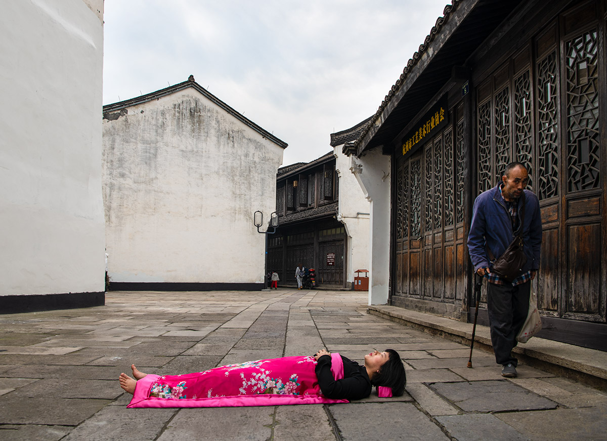 an elder man looks at Chun Hua Catherine Dong strangely in HangZhou, China 