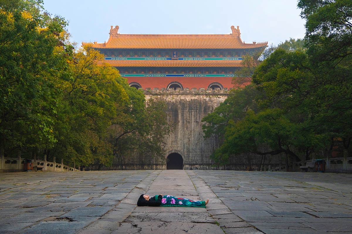 Chun Hua Catherine Dong celebrates her death and sleeps in front of historical building in Nanjing