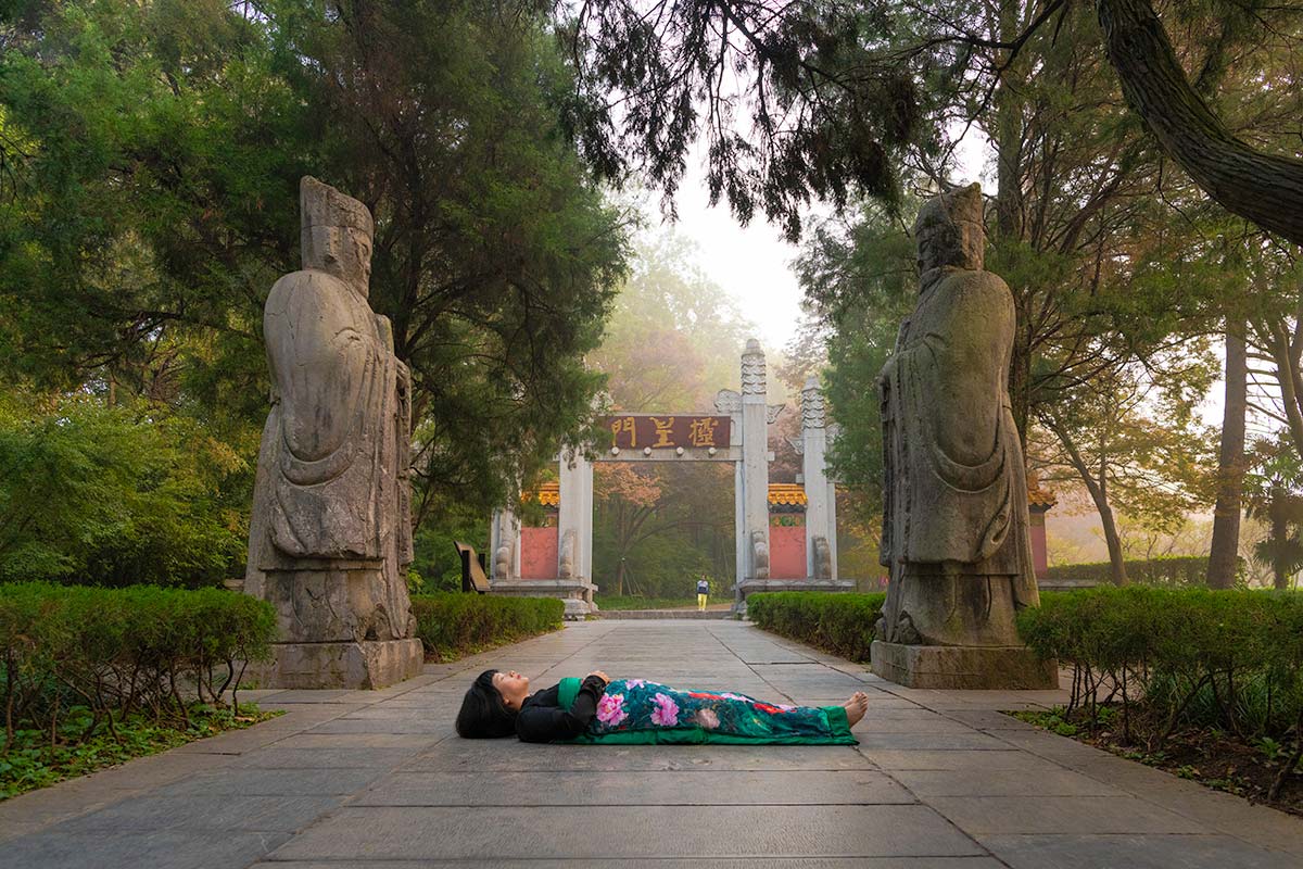 Chun Hua Catherine Dong celebrates her death and sleeps in front of monument in Nanjing