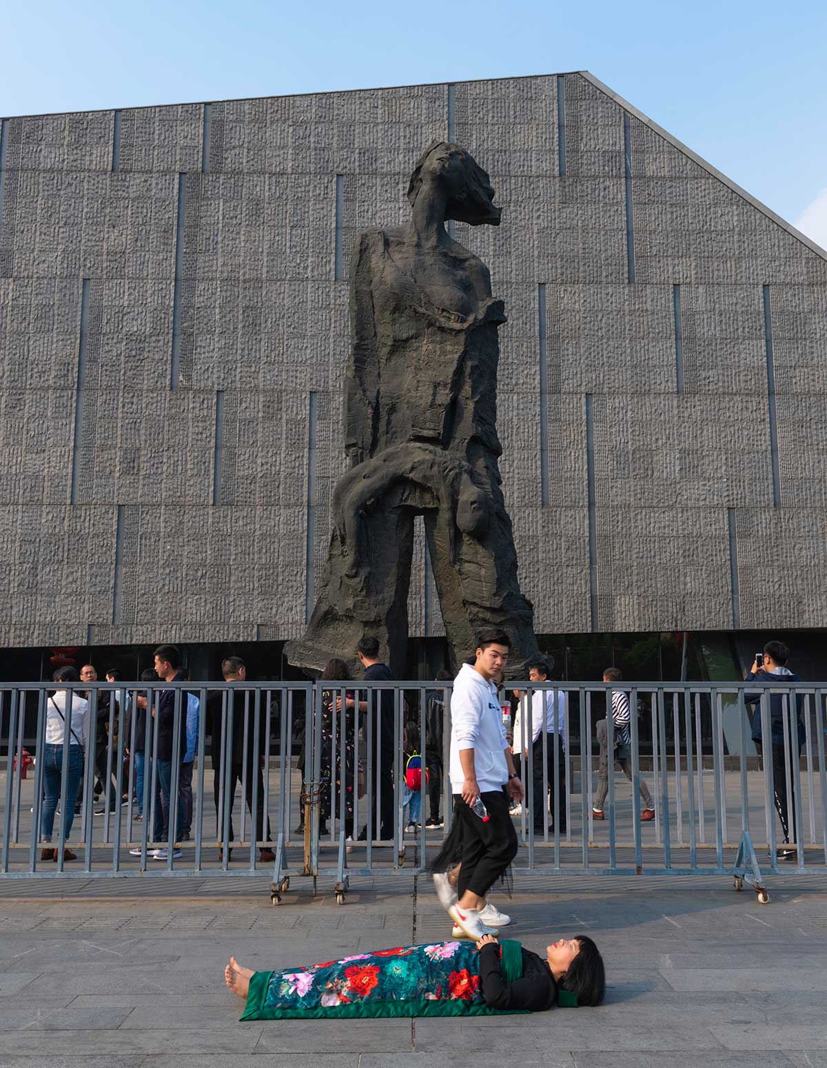 Chun Hua Catherine Dong celebrates her death and sleeps in front of monument in Nanjing