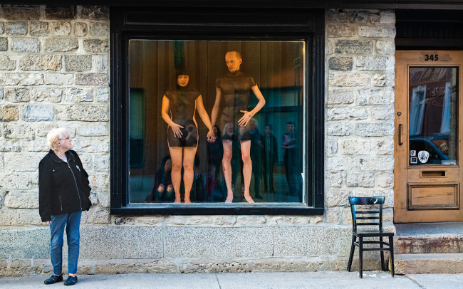 Chun Hua Catherine Dong and her performance partner wear mannequin torsos and perform on a window at Le Lieu, centre en art actuel, Quebec City