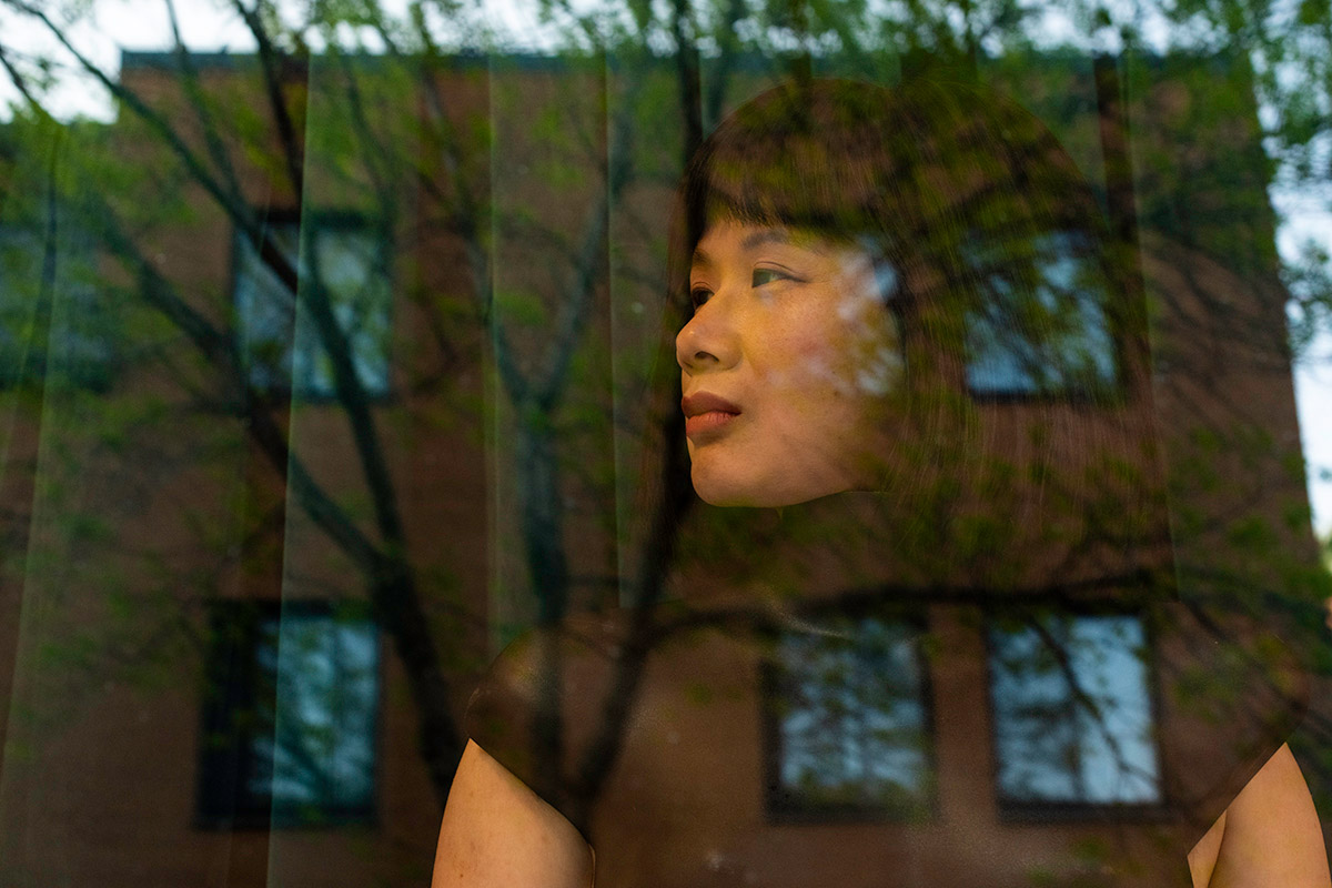 Chun Hua Catherine Dong and her performance partner wear mannequin torsos and perform on a window at Le Lieu, centre en art actuel, Quebec City 