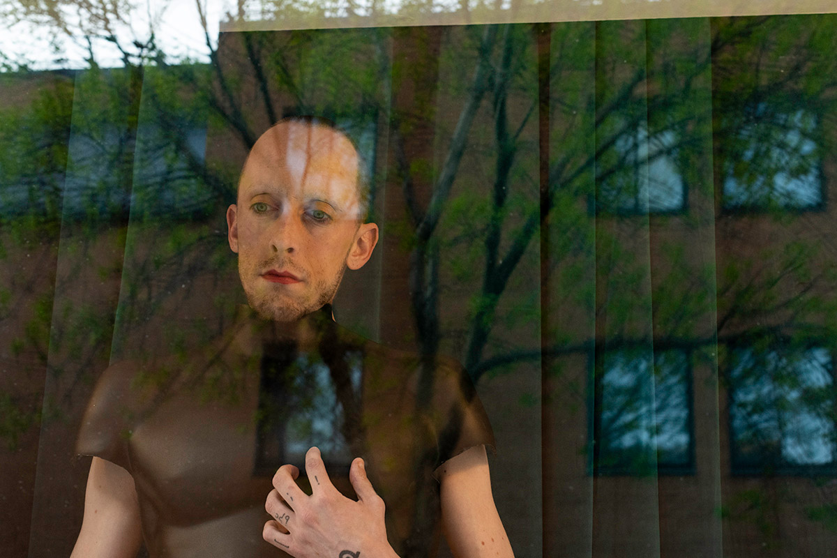 Chun Hua Catherine Dong and her performance partner wear mannequin torsos and perform on a window at Le Lieu, centre en art actuel, Quebec City 