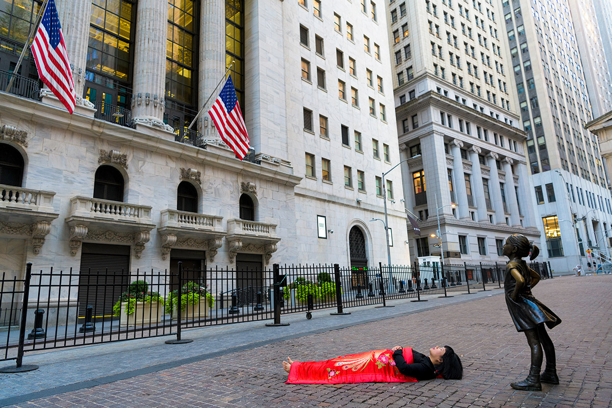 Chun Hua Catherine Dong is with the fearless girl in New York City