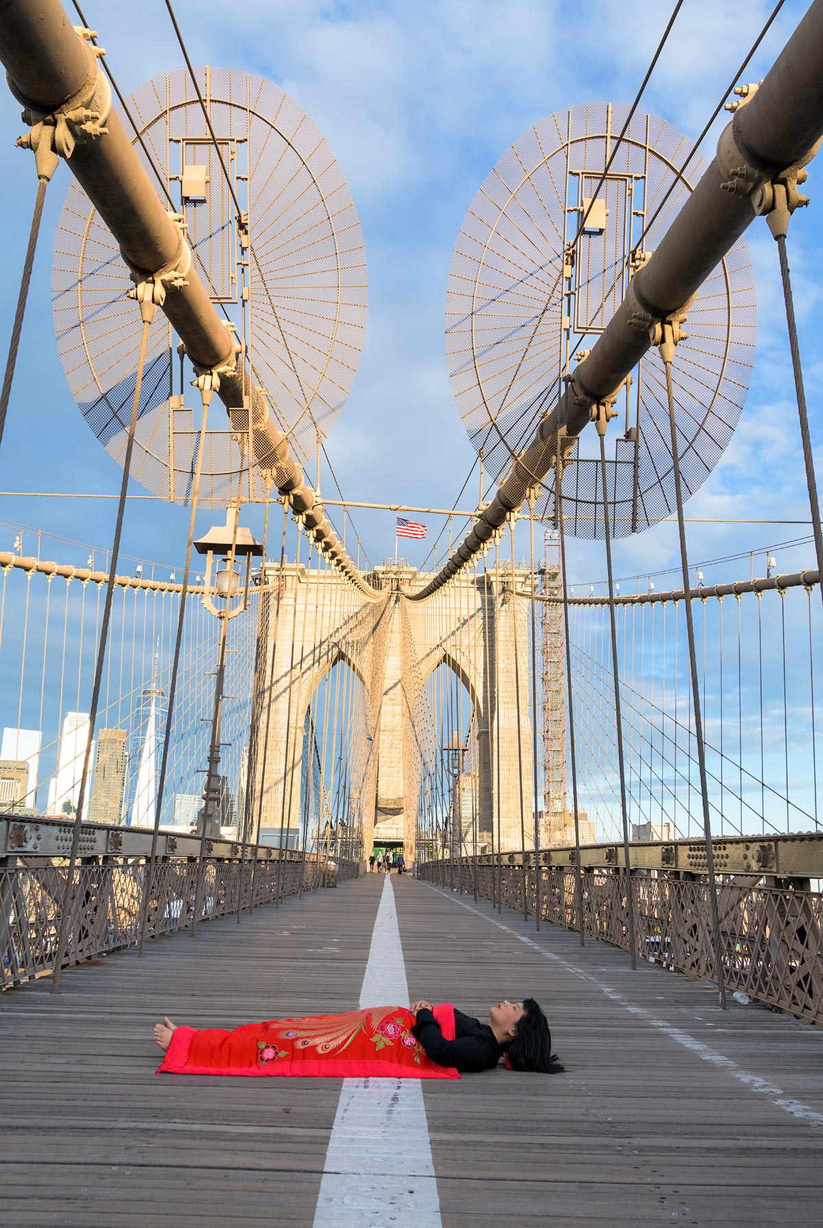 Chun Hua Catherine Dongs sleeps on Brooklyn Bridge in New York City