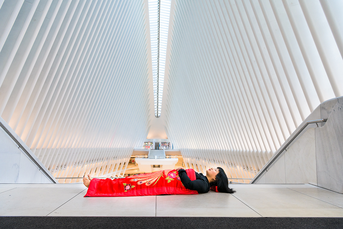 Chun Hua Catherine Dong sleeps inside the oculus world trade center in New York City