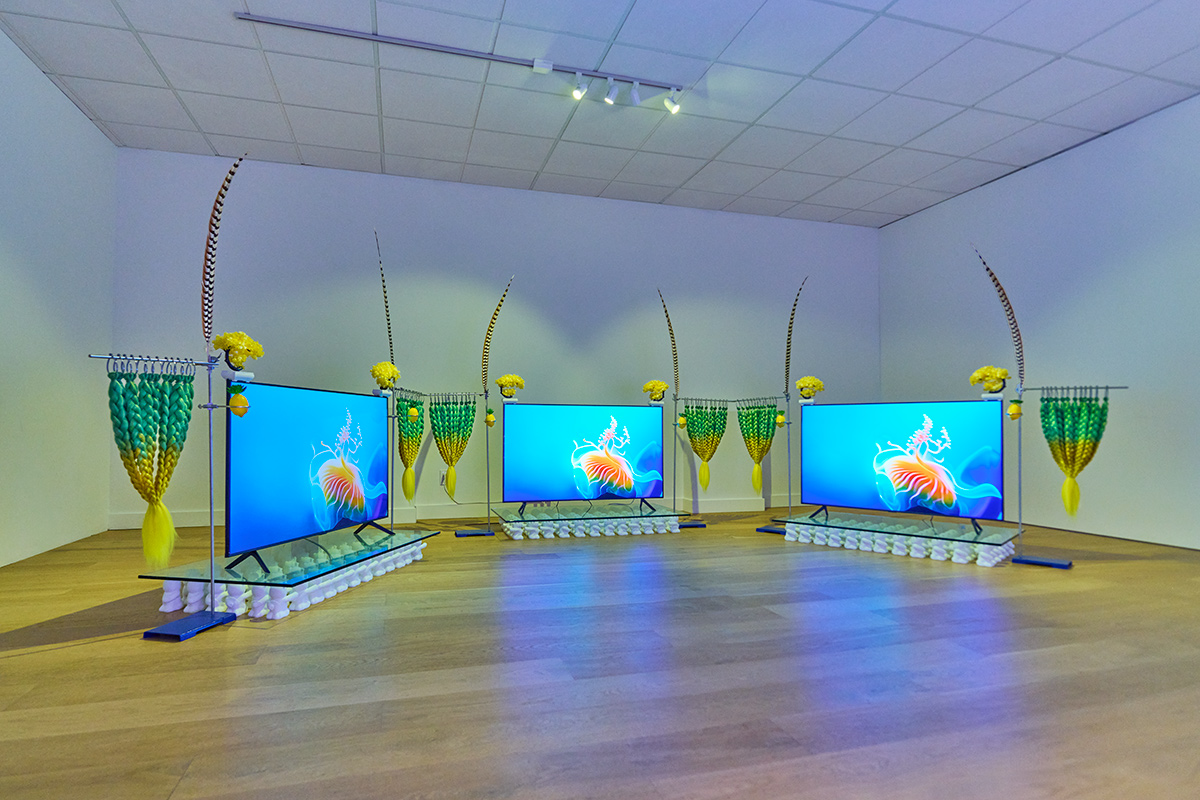 three channel video installation with green - yellow hair, feather, tempered glass and 3D printed bears