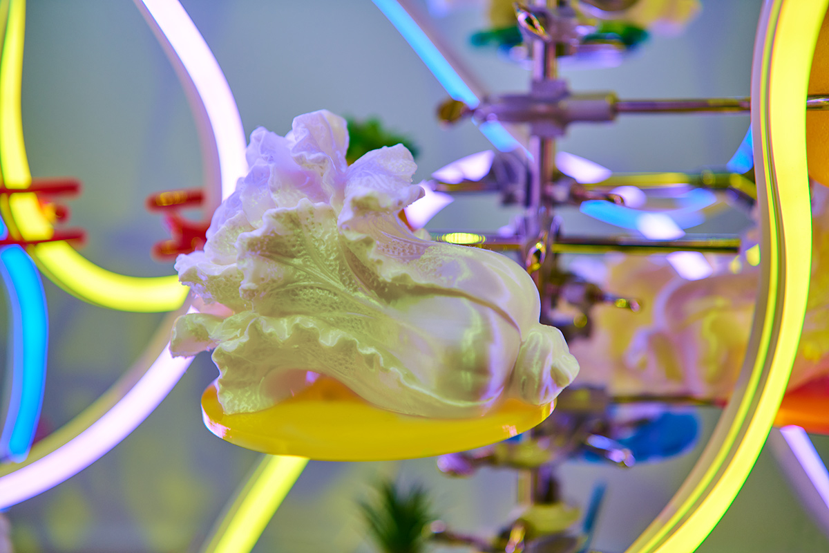 a white 3D printed Chinese cabbage surrounded by LED lights